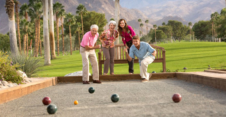 Group of friends playing a round of Bocce Ball