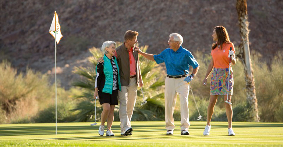 Mature group of friends enjoying a round of golf